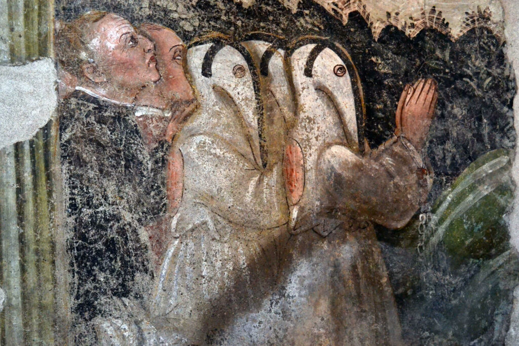 Particolare di un affresco con flagellanti nella chiesa di S. Giorgio a Cislano